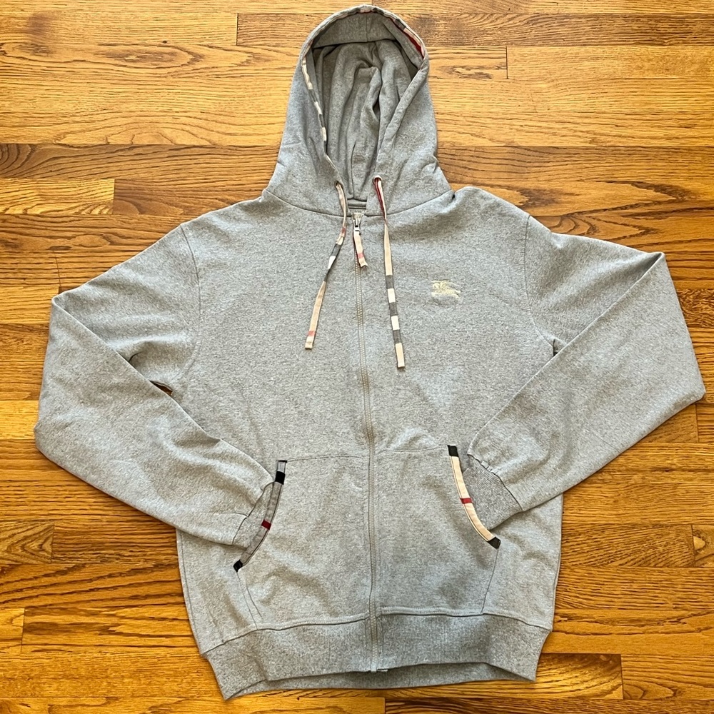 Burberry - Never before worn grey zip-up hoodie. Size XL. Tag still included.